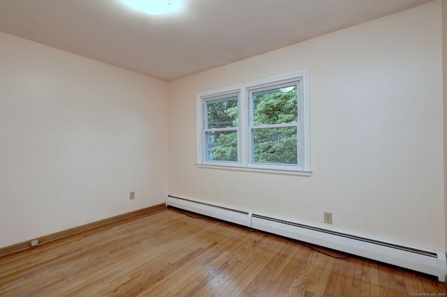 15 Edgemere Rd, Hamden, CT 06517 - unfurnished room featuring baseboard heating and light wood-style flooring