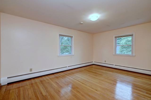 15 Edgemere Rd, Hamden, CT 06517 - empty room featuring healthy amount of natural light and wood finished floors