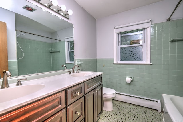 15 Edgemere Rd, Hamden, CT 06517 - full bath with a baseboard radiator, tile walls, double vanity,  shower combination, and a wainscoted wall