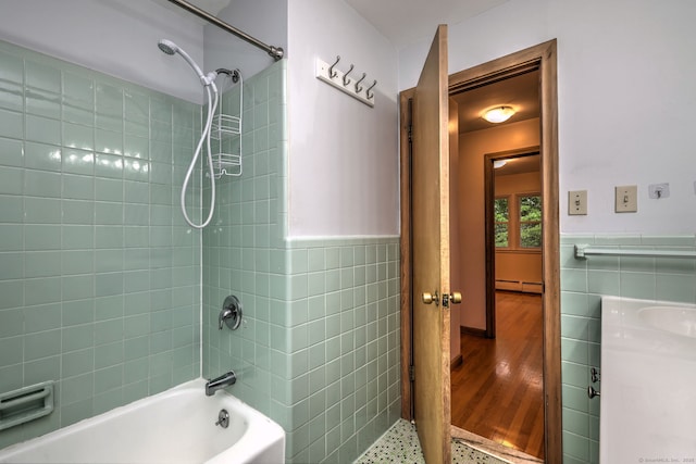 15 Edgemere Rd, Hamden, CT 06517 - full bathroom with a baseboard heating unit, tile walls, bathing tub / shower combination, wainscoting, and vanity