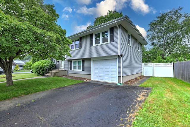 15 Edgemere Rd, Hamden, CT 06517 - view of front of house with asphalt driveway and an attached garage