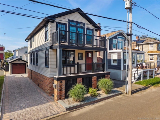 10 Point Beach Dr, Milford, CT 06460 - multi unit property with an outbuilding, a detached garage, brick siding, a balcony, and driveway