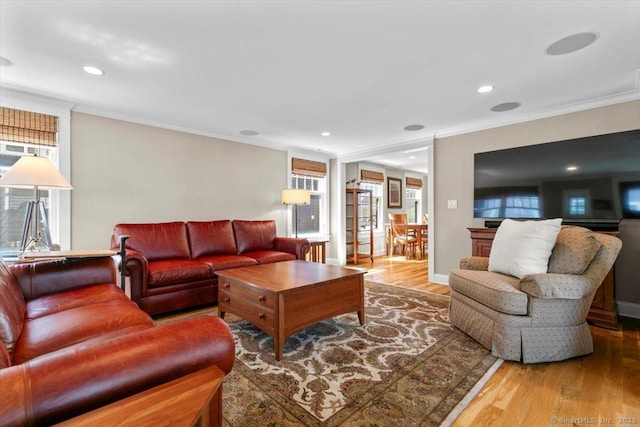 10 Point Beach Dr, Milford, CT 06460 - living room with ornamental molding, wood finished floors, plenty of natural light, and recessed lighting