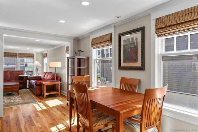 10 Point Beach Dr, Milford, CT 06460 - dining area with crown molding, light wood-style floors, and recessed lighting