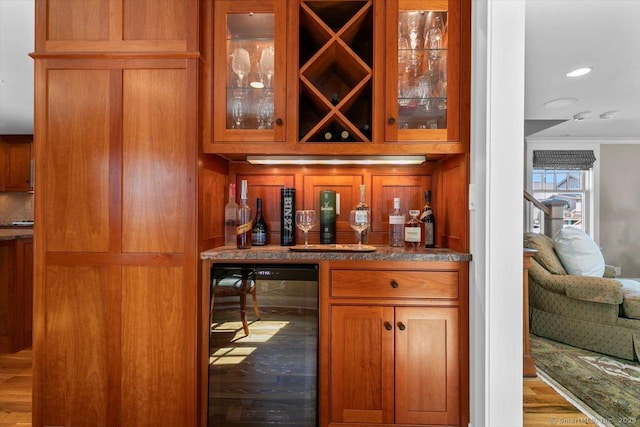 10 Point Beach Dr, Milford, CT 06460 - indoor dry bar with beverage cooler, ornamental molding, wood finished floors, and recessed lighting