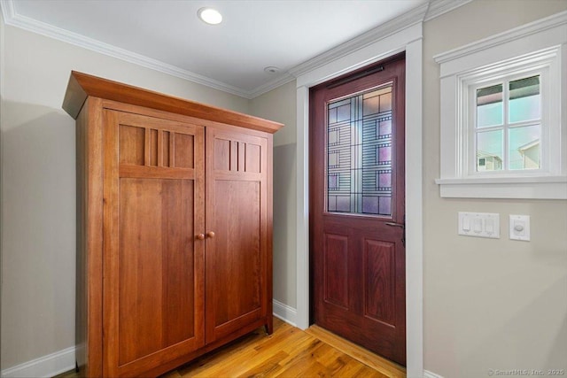 10 Point Beach Dr, Milford, CT 06460 - foyer with light wood-style floors, ornamental molding, and recessed lighting