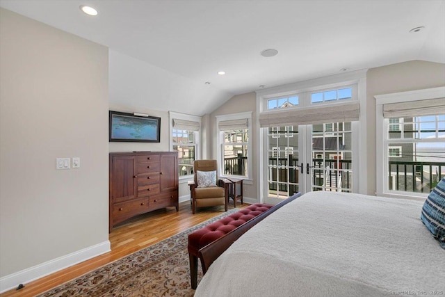 10 Point Beach Dr, Milford, CT 06460 - bedroom with lofted ceiling, access to outside, wood finished floors, multiple windows, and french doors