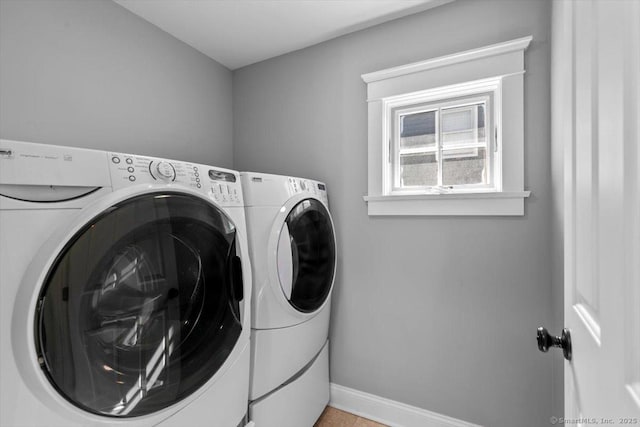 10 Point Beach Dr, Milford, CT 06460 - washroom with washer and clothes dryer and baseboards