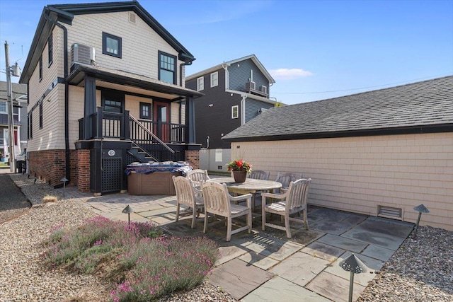 10 Point Beach Dr, Milford, CT 06460 - rear view of property with a hot tub and a patio area