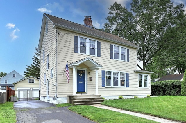 17 Norris St, Hamden, CT 06517 - colonial inspired home with a chimney and a detached garage