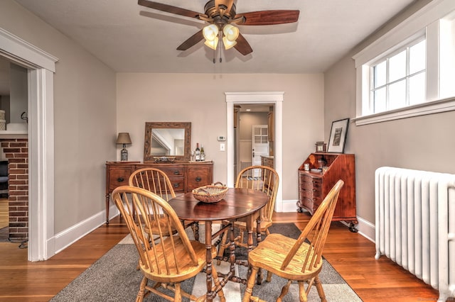 17 Norris St, Hamden, CT 06517 - dining room with radiator heating unit, ceiling fan, and wood finished floors