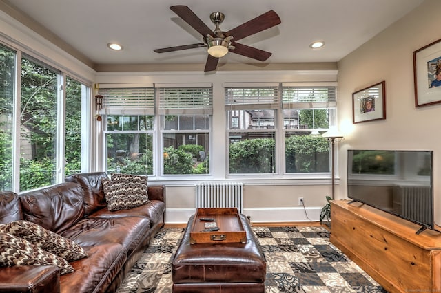 17 Norris St, Hamden, CT 06517 - living area with radiator heating unit, ceiling fan, wood finished floors, and recessed lighting