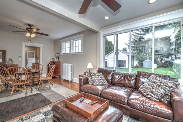 17 Norris St, Hamden, CT 06517 - living room featuring a ceiling fan, radiator, wood finished floors, and recessed lighting