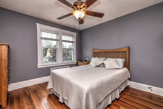 17 Norris St, Hamden, CT 06517 - bedroom featuring hardwood / wood-style floors, a textured ceiling, ceiling fan, and radiator heating unit