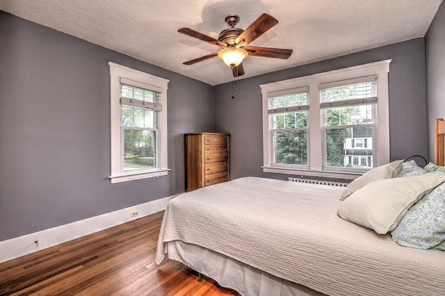 17 Norris St, Hamden, CT 06517 - bedroom with hardwood / wood-style flooring, a ceiling fan, and a textured ceiling