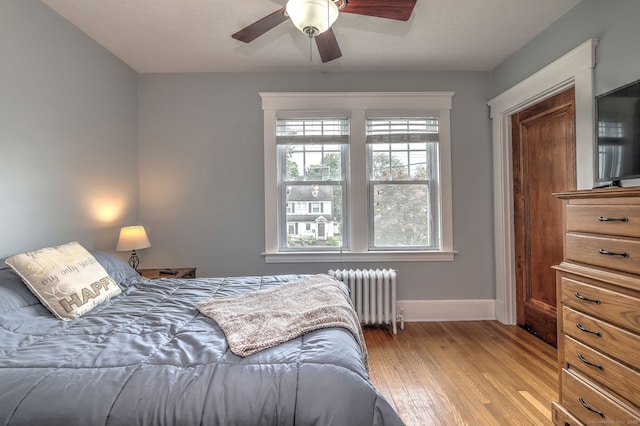 17 Norris St, Hamden, CT 06517 - bedroom featuring radiator, light wood finished floors, and a ceiling fan