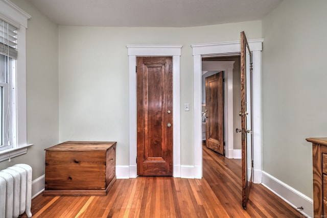 17 Norris St, Hamden, CT 06517 - bedroom featuring radiator and wood-type flooring