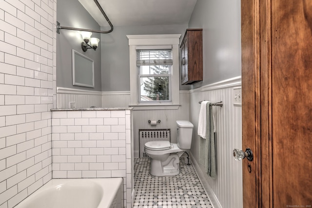 17 Norris St, Hamden, CT 06517 - full bathroom featuring wainscoting, radiator heating unit, a tub, and tile patterned flooring