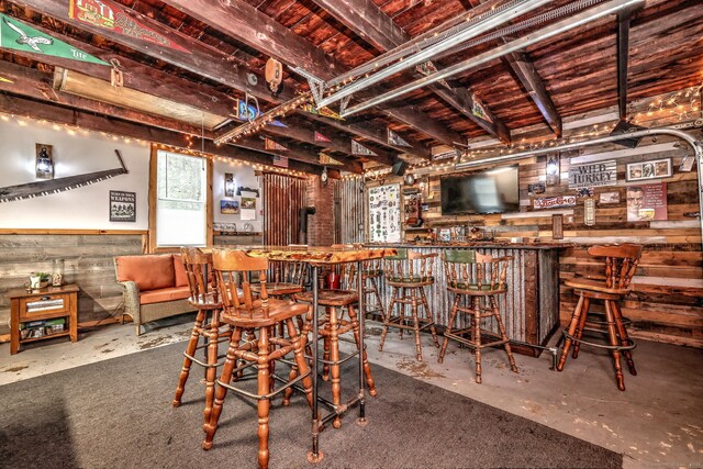 17 Norris St, Hamden, CT 06517 - dining room with a dry bar, unfinished concrete flooring, and wood ceiling