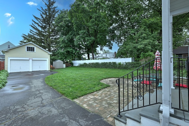 17 Norris St, Hamden, CT 06517 - view of yard featuring stairway, a garage, and a storage shed