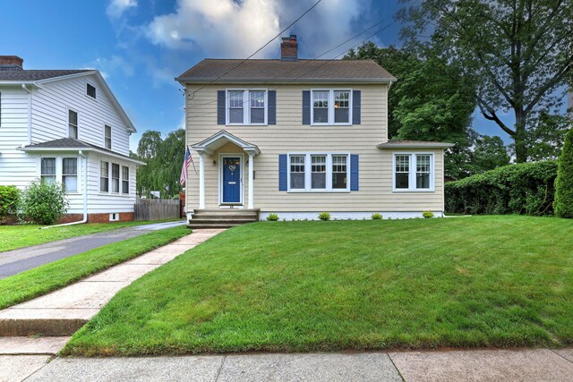 17 Norris St, Hamden, CT 06517 - colonial-style house featuring a chimney