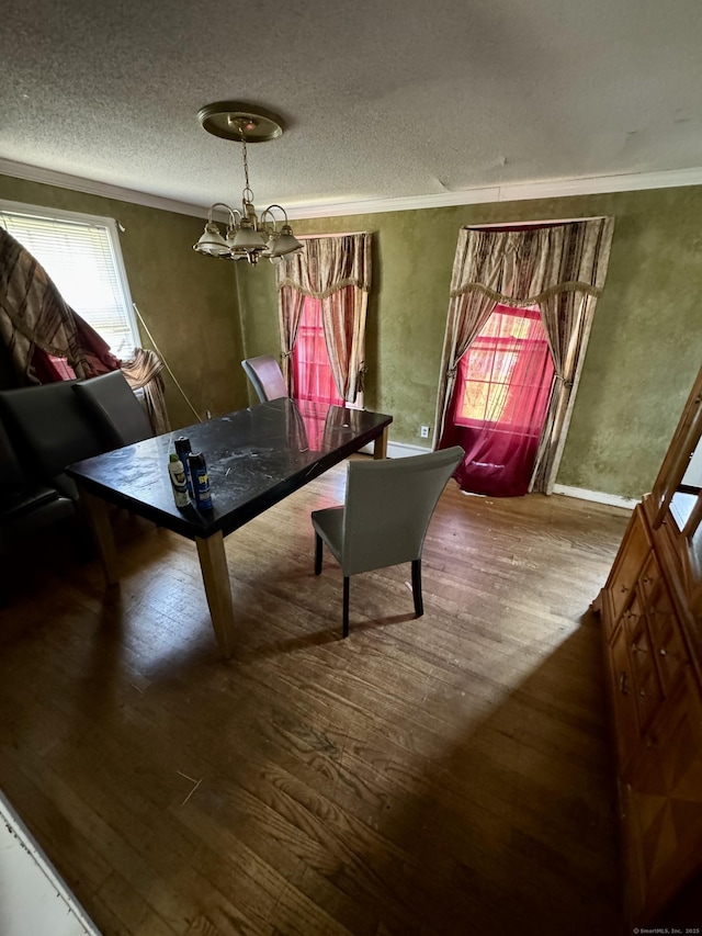 38 Makara St, Plymouth, CT 06786 - dining space featuring wood finished floors, a textured ceiling, a chandelier, and ornamental molding