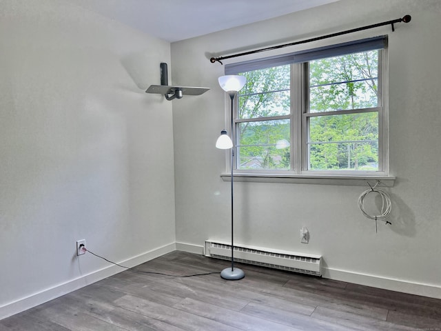 4 Belair Dr Unit 4, New Milford, CT 06776 - empty room featuring a baseboard radiator, baseboards, and wood finished floors