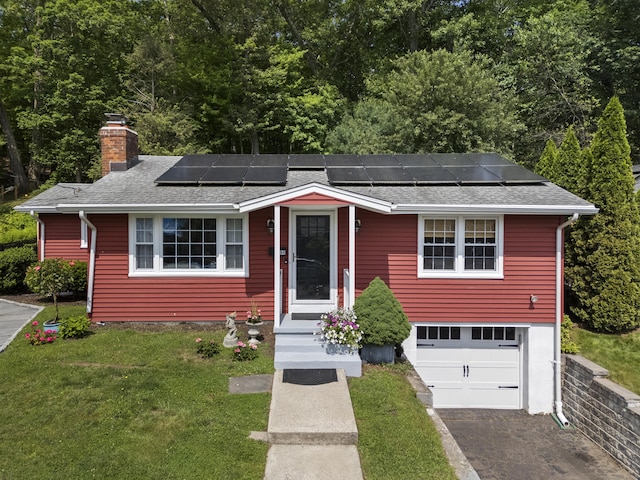 96 Long Hill Ter, New Haven, CT 06515 - view of front facade with a front yard, a garage, asphalt driveway, a chimney, and a shingled roof