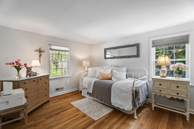 96 Long Hill Ter, New Haven, CT 06515 - bedroom featuring multiple windows, light wood-type flooring, and baseboards