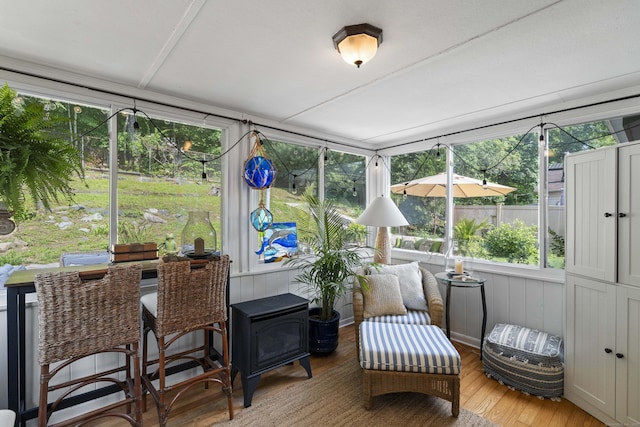 96 Long Hill Ter, New Haven, CT 06515 - sunroom featuring a wood stove and wood-type flooring