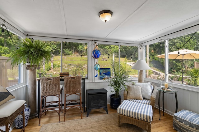 96 Long Hill Ter, New Haven, CT 06515 - sunroom / solarium featuring wood finished floors and a wood stove