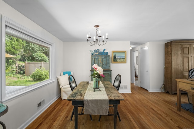 96 Long Hill Ter, New Haven, CT 06515 - dining room featuring a chandelier, baseboards, and wood finished floors
