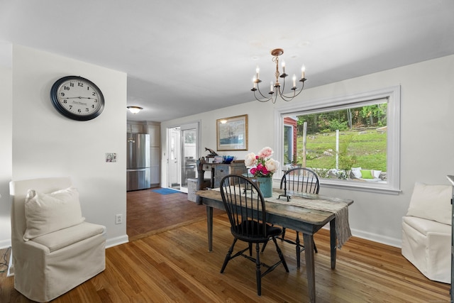 96 Long Hill Ter, New Haven, CT 06515 - dining room featuring a chandelier, baseboards, and wood finished floors