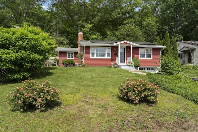 96 Long Hill Ter, New Haven, CT 06515 - ranch-style house with solar panels, a front yard, and a chimney