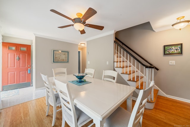137 Roosevelt Dr, Seymour, CT 06483 - dining space with light wood-style floors, crown molding, stairs, ceiling fan, and baseboards
