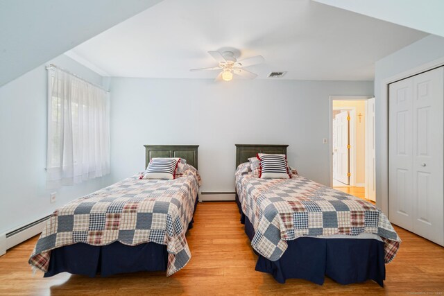 137 Roosevelt Dr, Seymour, CT 06483 - bedroom featuring a baseboard heating unit, a closet, and light wood-style floors