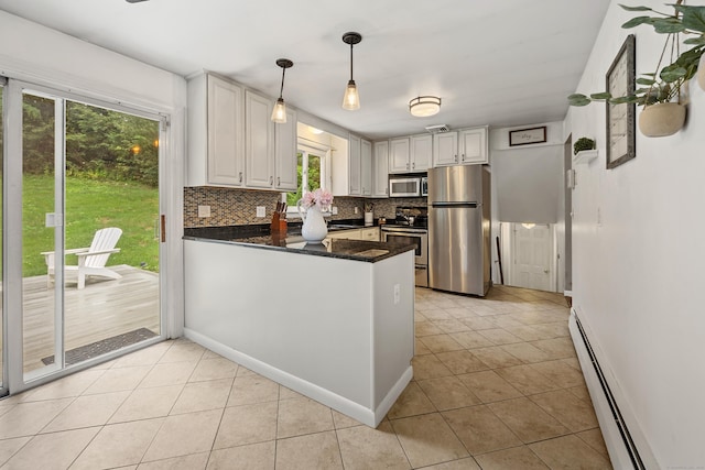 277 Tryon St, Middletown, CT 06457 - kitchen featuring stainless steel appliances, a baseboard radiator, decorative backsplash, a peninsula, and light tile patterned floors