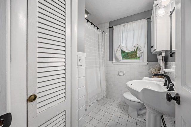 277 Tryon St, Middletown, CT 06457 - full bath with tile walls, tile patterned floors, baseboard heating, a shower with curtain, and wainscoting