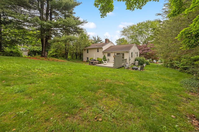 277 Tryon St, Middletown, CT 06457 - view of grassy yard with a wooden deck and a fire pit