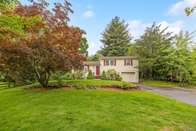 277 Tryon St, Middletown, CT 06457 - split level home featuring driveway, a garage, and a front lawn