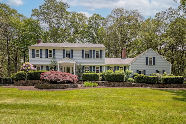 305 Thayer Pond Rd, Wilton, CT 06897 - view of front facade with a chimney and a front yard