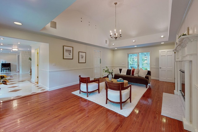 305 Thayer Pond Rd, Wilton, CT 06897 - living room with hardwood / wood-style floors, recessed lighting, a raised ceiling, a fireplace with flush hearth, and baseboards