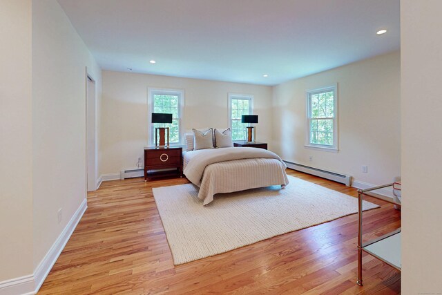 305 Thayer Pond Rd, Wilton, CT 06897 - bedroom featuring a baseboard heating unit, light wood finished floors, baseboards, and recessed lighting