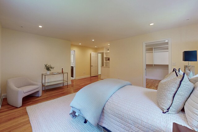 305 Thayer Pond Rd, Wilton, CT 06897 - bedroom featuring light wood-style flooring, recessed lighting, baseboards, a spacious closet, and a closet