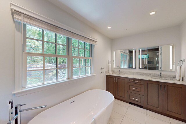 305 Thayer Pond Rd, Wilton, CT 06897 - bathroom with double vanity, a freestanding tub, a stall shower, and recessed lighting