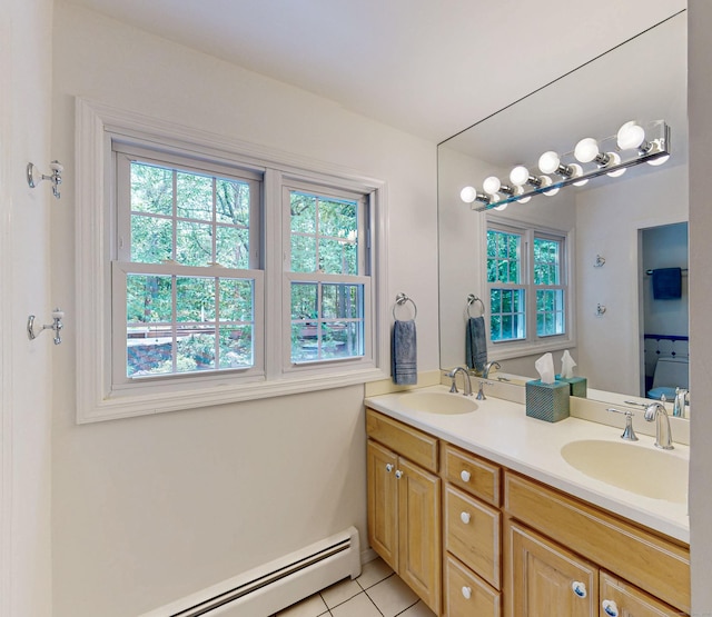 305 Thayer Pond Rd, Wilton, CT 06897 - bathroom with healthy amount of natural light, double vanity, and a baseboard radiator