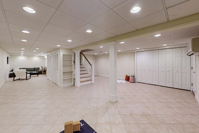 305 Thayer Pond Rd, Wilton, CT 06897 - finished basement featuring recessed lighting, a paneled ceiling, baseboards, stairs, and an AC wall unit