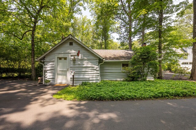 305 Thayer Pond Rd, Wilton, CT 06897 - view of front of home with a chimney and roof with shingles