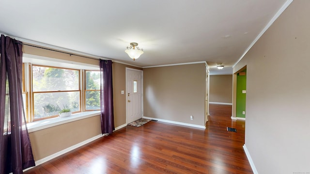 174 Round Hill Rd, Meriden, CT 06450 - foyer entrance with crown molding, baseboards, and wood finished floors