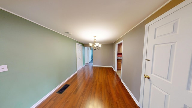 174 Round Hill Rd, Meriden, CT 06450 - hall with a chandelier, baseboards, ornamental molding, and wood finished floors